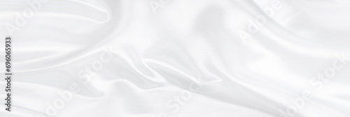 White gray satin texture that is white silver fabric silk background with beautiful soft blur pattern natural. photo