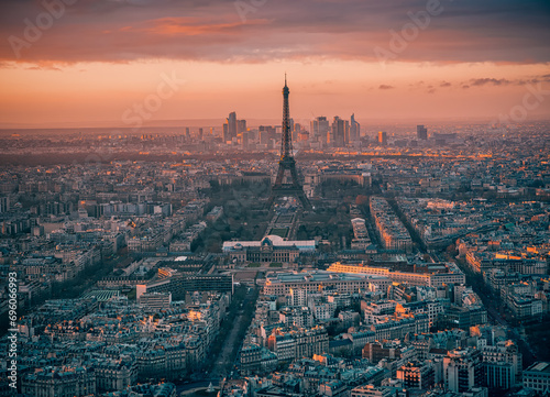 Paris, France: Aerial view over the city with Eiffel tower and La Defense modern architecture behind it
