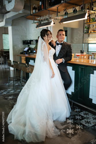 bride and groom inside a cocktail bar