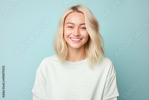 Vibrant Young Blonde Smiling on Light Blue Background. Generative AI.