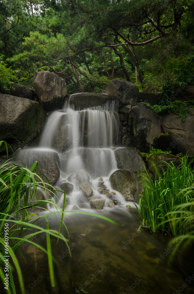 Naklejka premium Little waterfall shot with long exposure in Seoul, South Korea.