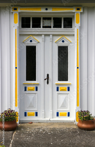 Old traditional painted wooden house entrance door