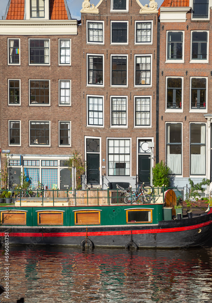houseboat and townhouse on the canal, Amsterdam