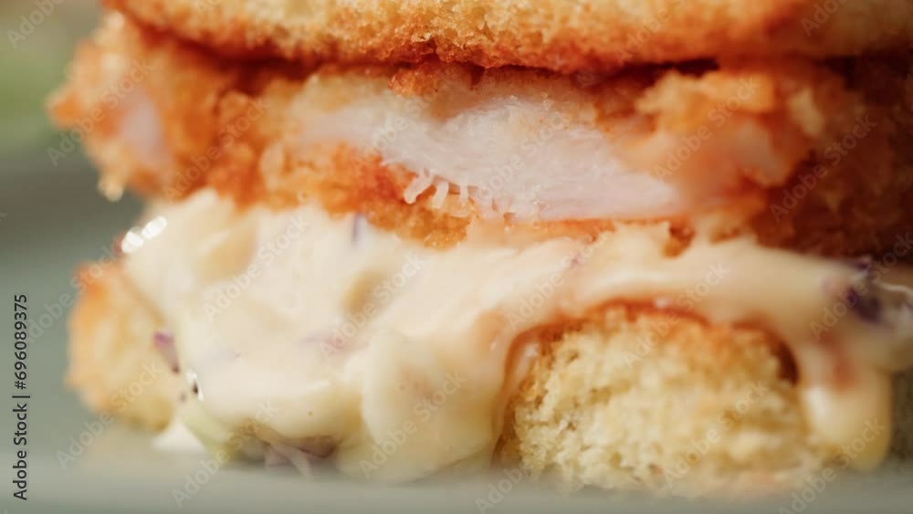 American deep fried fish or chicken sandwich with ham meet cuts in restaurant, cooking Famous thick cut sous vide beef sandwich on restaurant cafe kitchen. American deep fried fish or chicken sandwich with ham meet cuts in restaurant, cooking Famous thick cut sous vide beef sandwich on restaurant cafe kitchen.