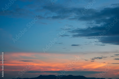 Last rays of sun on cinematic colorful contrast sunset sky with nobody on the horizon