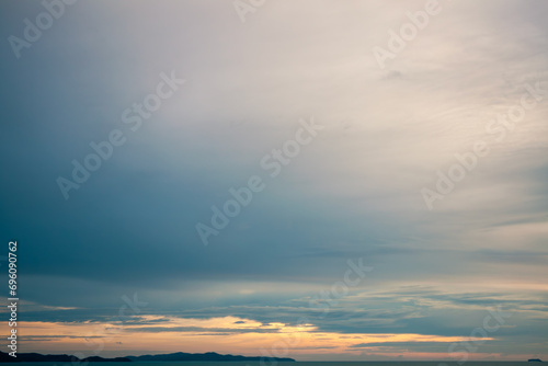 Romantic sky in pastel nude colors with hazy clouds and sunbeam on the horizon surrounded by cinematic environment © ABContent Creator