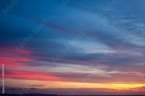 Amazing natural fenmen on the romantic colorful sunset sky with illuminated contrast warm clouds on the horizon surrounded by cinematic atmosphere  © ABContent Creator