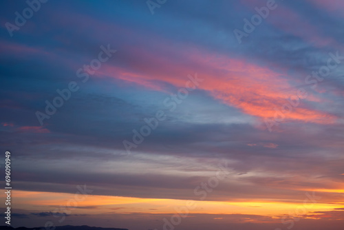 Amazing natural fenmen on the romantic colorful sunset sky with illuminated contrast warm clouds on the horizon surrounded by cinematic atmosphere  © ABContent Creator