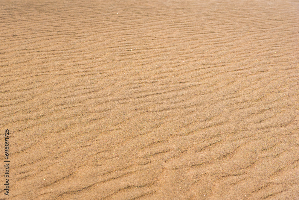 Desert sand pattern during the day light. wave sand parttern of the desert isolated. Desert sand pattern during the day light. wave sand parttern of the desert isolated.