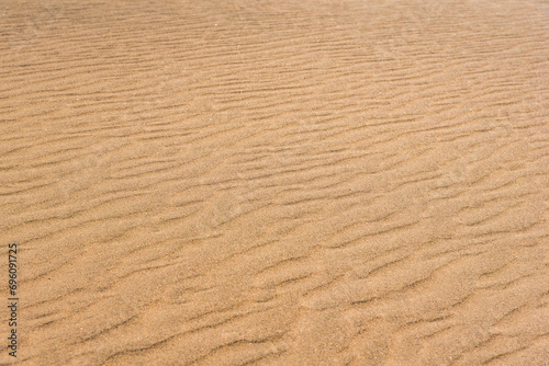 Desert sand pattern during the day light. wave sand parttern of the desert isolated.