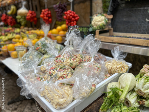 Homemade orecchiette, traditional italian dried pasta sold in market in Bari, Southern Italy. photo