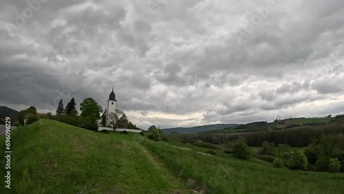 beautiful panorama view of Church of Saint Lawrence at Zdoun, Sumava region,Czech republic,Europe,beautiful church with tower in mountains of Czechia photo