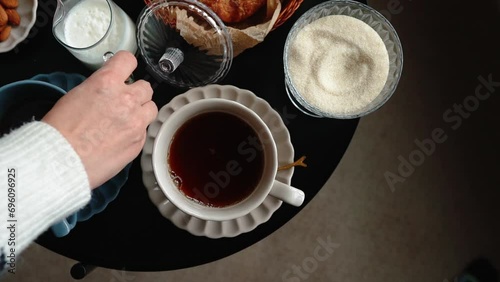 Aesthetic breakfast. Milk coffee, milk tea, sugar, almond, almond cakes, biscuits, marzipans and puffs. British breakfast in a cozy home. Autumn mood.