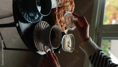 Aesthetic breakfast. Milk coffee, milk tea, sugar, almond, almond cakes, biscuits, marzipans and puffs. British breakfast in a cozy home. Autumn mood. Vertical video.