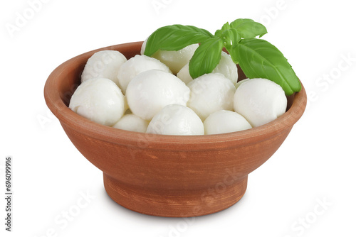 Mini mozzarella balls with basil leaf in a ceramic bowl isolated on white background with full depth of field.