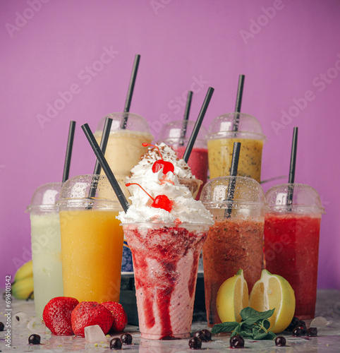 A selection of juices with natural fruits, milkshakes, dessert, pineapple, strawberry and pomegranate
