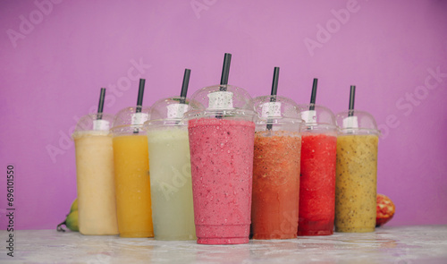 A selection of juices with natural fruits, milkshakes, dessert, pineapple, strawberry and pomegranate