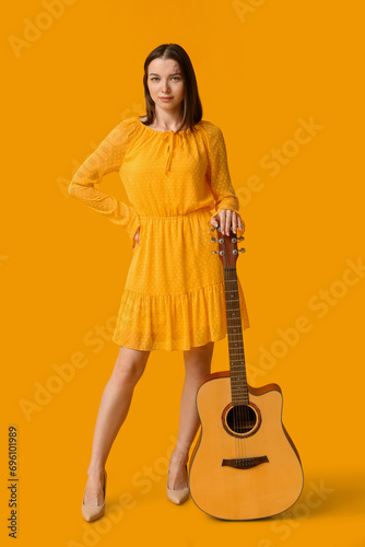 Pretty young woman with aco...