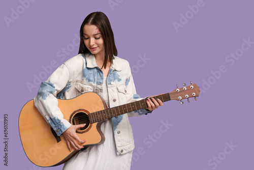 Pretty young woman playing ...