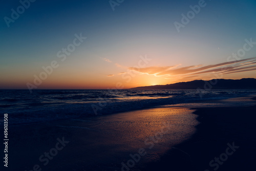 Late evening sunset on the beach photo