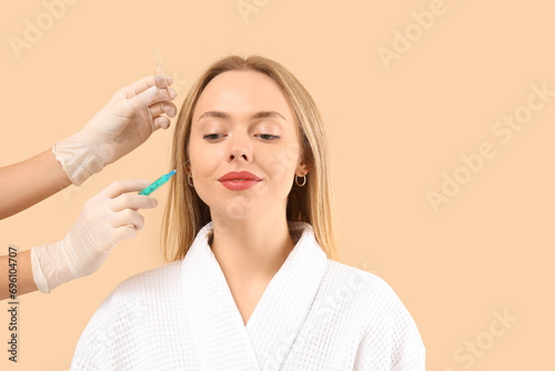 Young woman receiving fille...