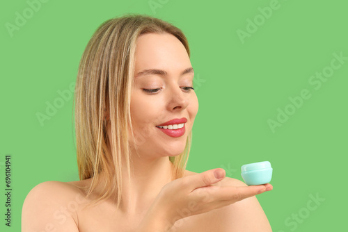 Pretty young woman with jar...