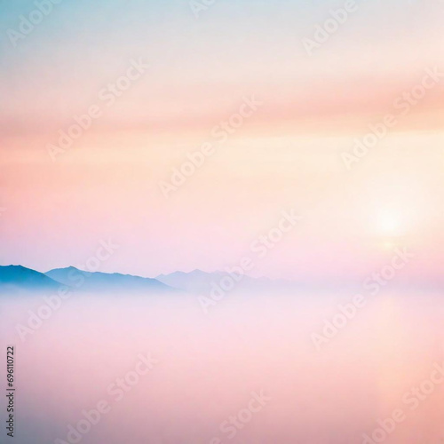 Bello Paisaje de amanecer con el sol al fondo y cielo en tonos rosa pastel degradados, montañas con neblina matutina y un lago que refleja el cielo.