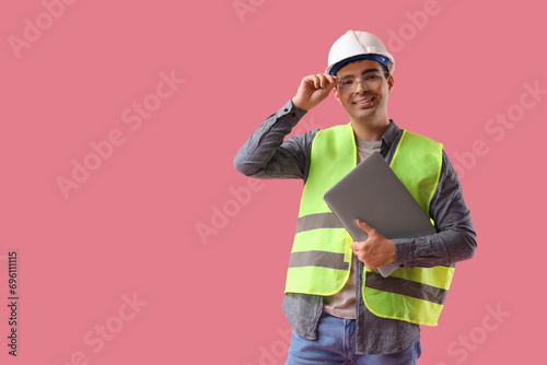Young male worker in eyegla...