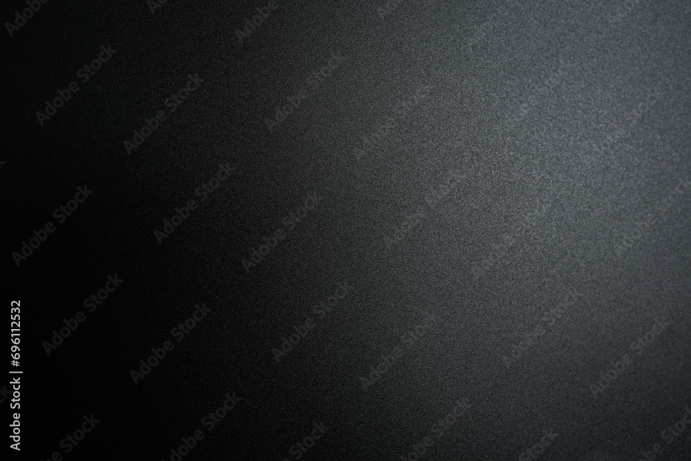 Black paper background with light for adding letters. Black paper background with light for adding letters.