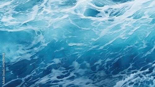 Foamy ocean waves with deep blue hues and white foam