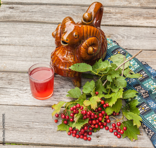 Drink and a branch of viburnum and Ukrainian vessel 