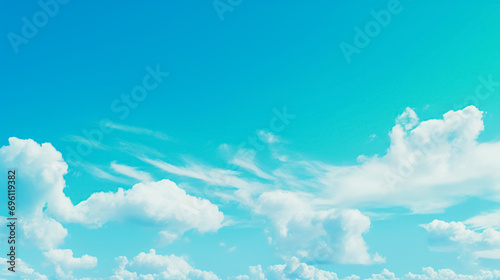 Bright sky with dynamic fluffy clouds, ranging from wispy to cumulus, against a vivid blue background.