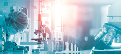 Double exposure microscope and Young woman scientific using equipment in the laboratory for research.Biotechnology,development,chemical,vaccine,Photo concept experimentation and research.