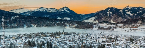 Sunset over Oberstdorf, Oberallgaeu, Bavaria, Germany, behind Hoher Ifen, 2230m, Gottesackerplateau, Toreck, 2017m, Kleinwalsertal, Vorarlberg, Allgaeu Alps, Austria, Europe photo