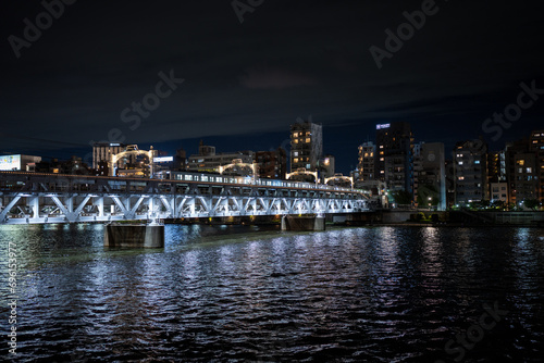 train bridge over the sumida river in tokyo japan at night