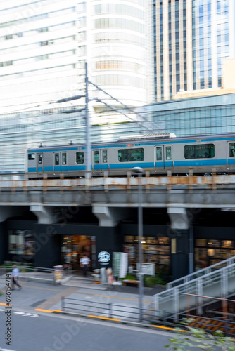 train coming into the station with a blured motion on the surrounding environment