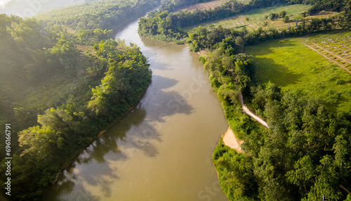 Aerial shot of tranquil morning river amid untouched nature