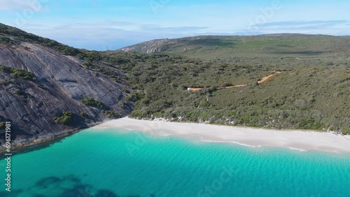Drone panning around scenic landscape in the Southern part of Western Australia with crystal clear blue water below. photo