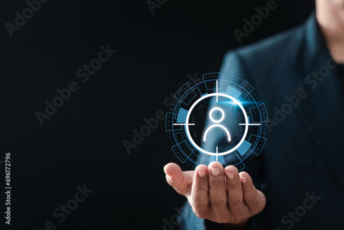 Customer Relationship Management. Businessman holding to target customer icon on vuital screen for customer centric strategies. Target customer, Marketing plan and strategies.