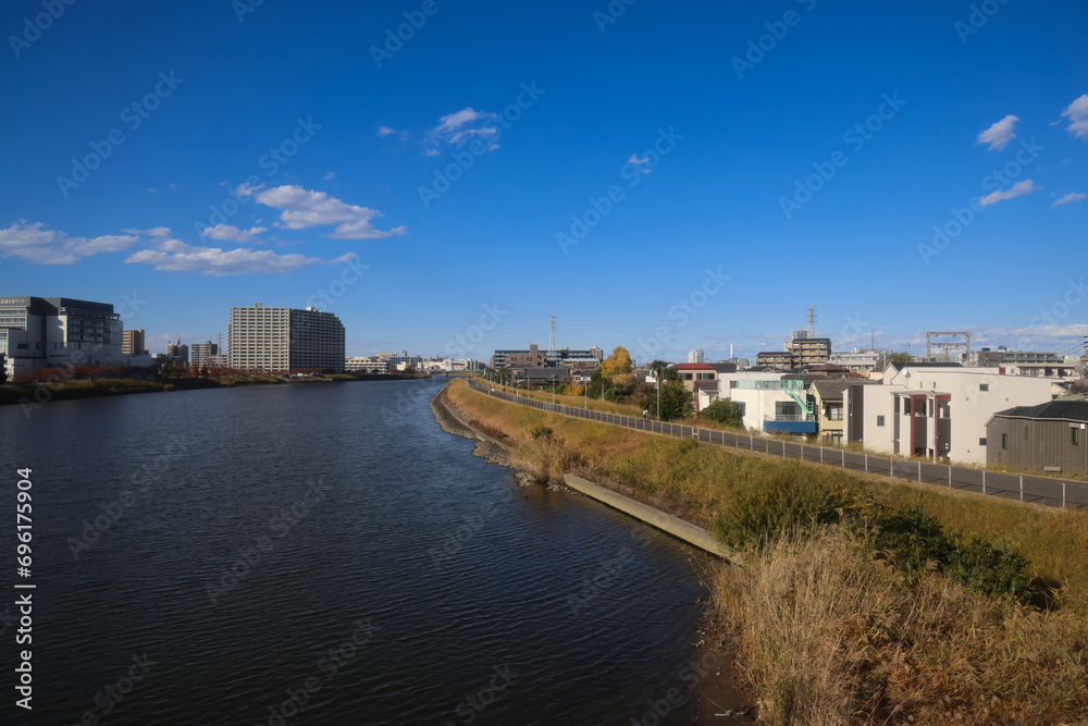 Nov 30 2023 City skyline at dawn with blue sky and water reflection Nov 30 2023 City skyline at dawn with blue sky and water reflection