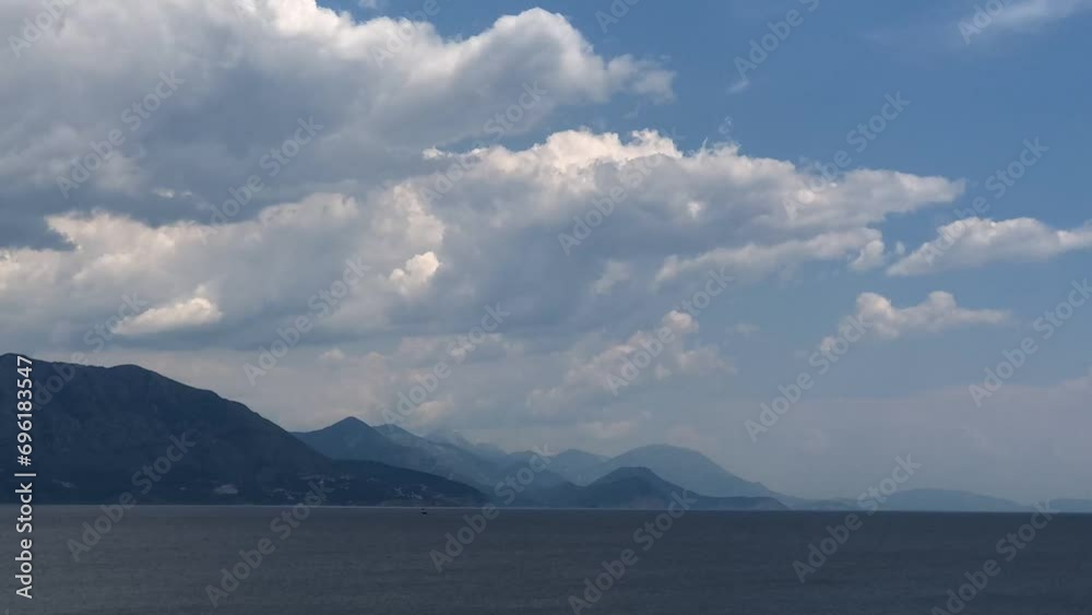 Timelapse of cumulus clouds running fast over the breathtaking panorama of the Montenegro coast. Timelapse of cumulus clouds running fast over the breathtaking panorama of the Montenegro coast.