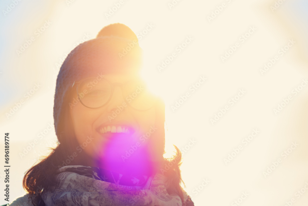 Sunflare frames a warm, happy smile
