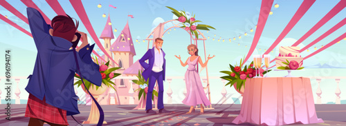 Groom and bride under wedding arch draped and decorated with flowers and photographer in festive romantic marriage setup with rose bouquet outside against fairytale castle. Cartoon happy couple.