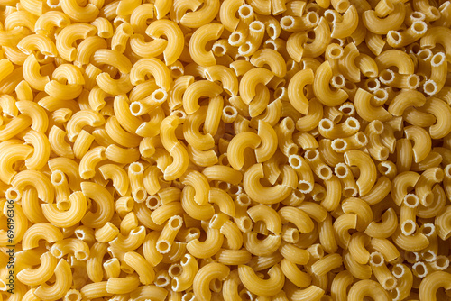 Uncooked Chifferi Rigati Pasta: A Culinary Canvas of Chifferi Rigati, Creating a Lively and Textured Background for Gourmet Cooking. Dry Pasta. Raw Macaroni - Top View, Flat Lay