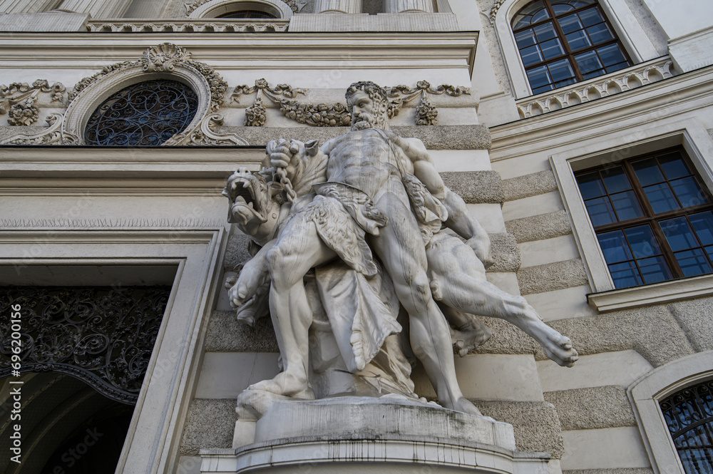 Baroque statues on the entrance gate of St. Michael's Wing of Hofburg Palace on Michaelerplatz in Vienna, Austria