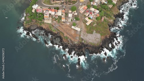 Rugged Coast Of Cidade Velha Town On The Island of Santiago, Cape Verde. Aerial Tilt-up Shot photo