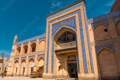 The Kutlimurodinok Madrasah next to Islam Hoja Minaret in Khiva, Uzbekistan.
