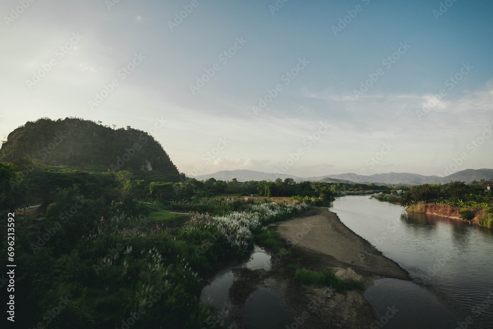 River in the middle of the mountains at sunset