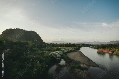River in the middle of the mountains at sunset
