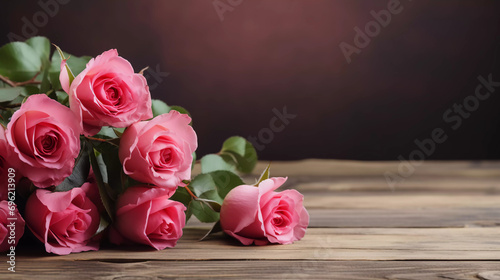 beautiful rose flowers on a wooden table - copy space 